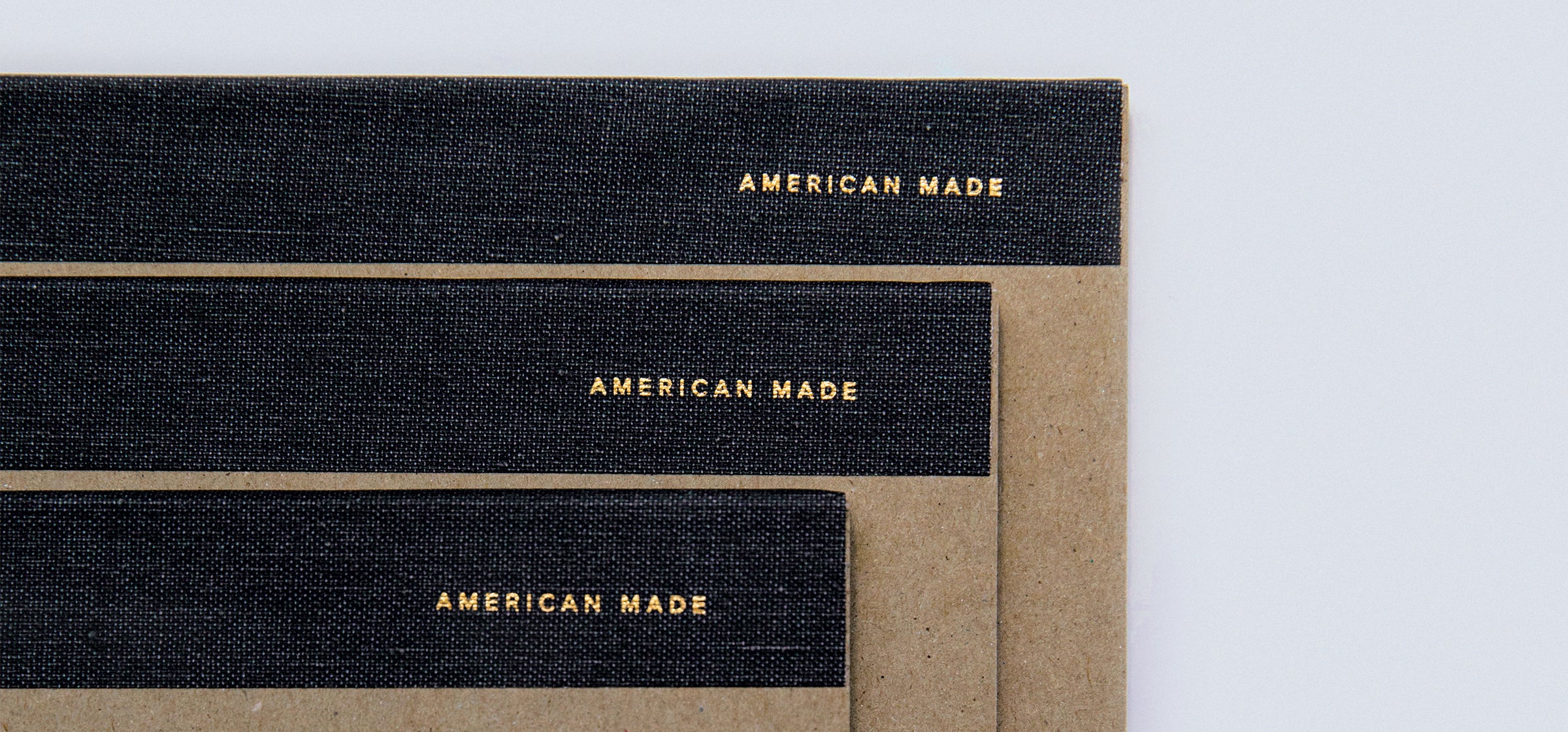 3 Legal Pads are stacked offset, displaying a foilstamped "American made" detail