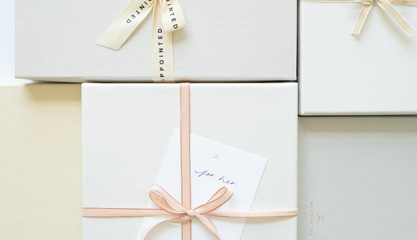 Blossom pink notebook held against a pink shirt