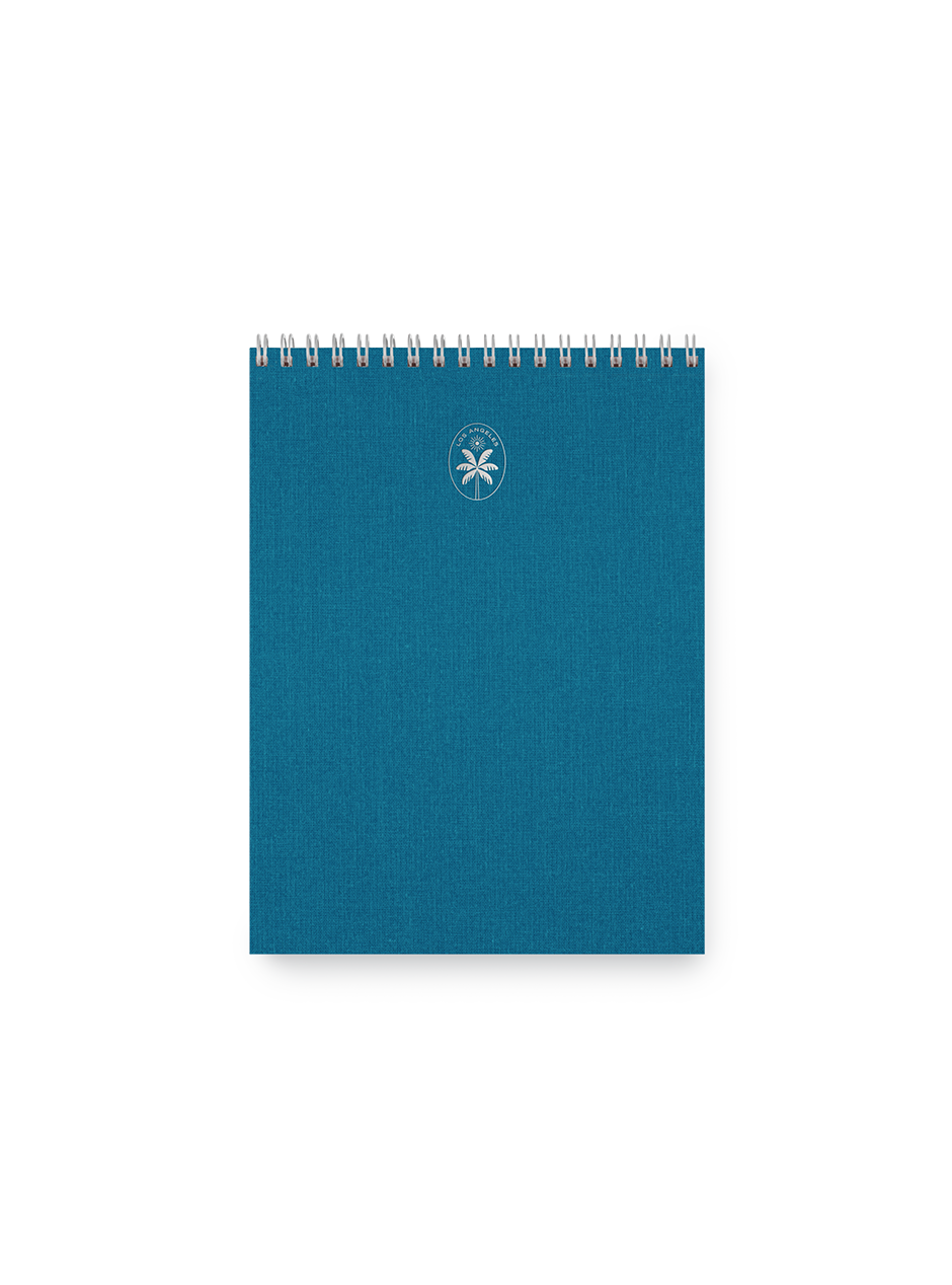 Los Angeles Notepad with Atlas Blue cover, silver wire-o binding, and silver foil stamped signet. || Atlas Blue