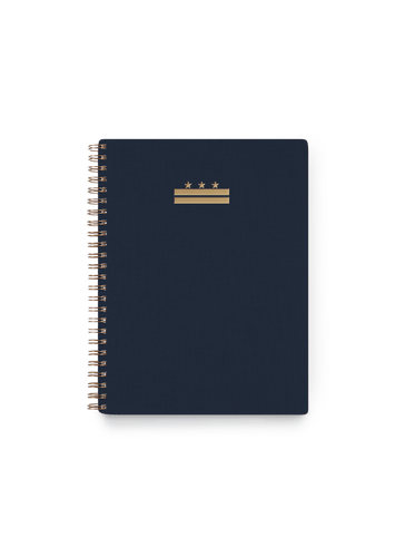 Appointed DC Workbook in Oxford Blue with bookcloth cover, DC foilstamped flag, and brass wire-o binding, front view || Oxford Blue