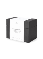 Diagonal view of desktop storage box with band around it || Onyx