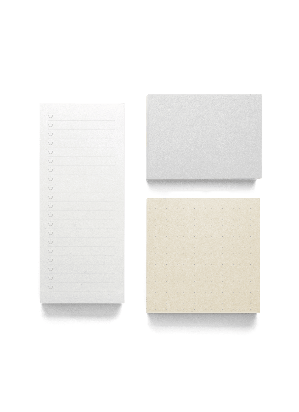 The Appointed Memo Pad in neutral with each pad spaced out, birds-eye view. || Neutrals