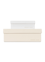 Smaller ecru box stacked on top of a bigger porcelain box, both with gold foil details || Ecru and Porcelain