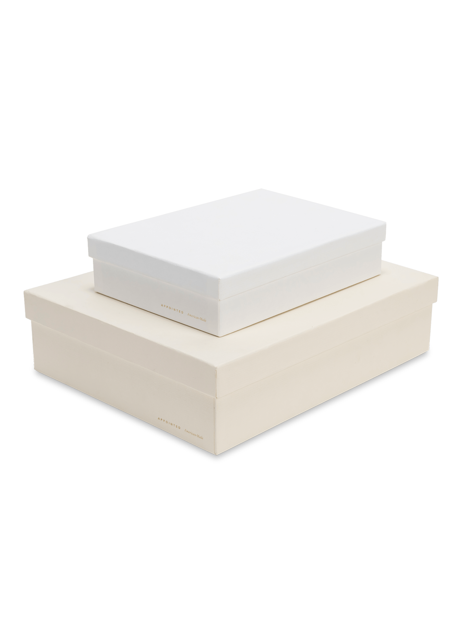 Diagonal view of smaller ecru box stacked on top of a bigger porcelain box, both with gold foil details || Ecru and Porcelain