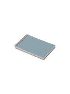 Appointed Pocket Notepad in Chambray Blue bookcloth with brass wire-o binding front angled view