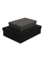 Diagonal view of smaller slate box stacked on top of a bigger charcoal box, both with gold foil details || Onyx and Slate